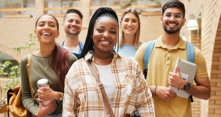 Diverse students smiling together indoors