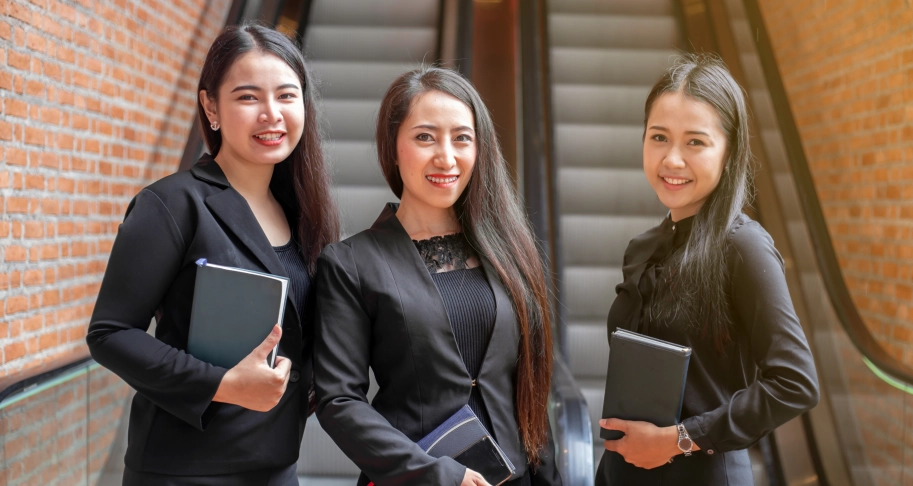 Businesswomen smiling in modern office