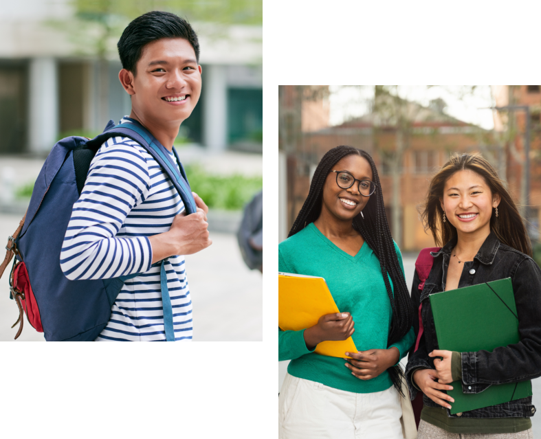 Students smiling and holding notebooks outdoors